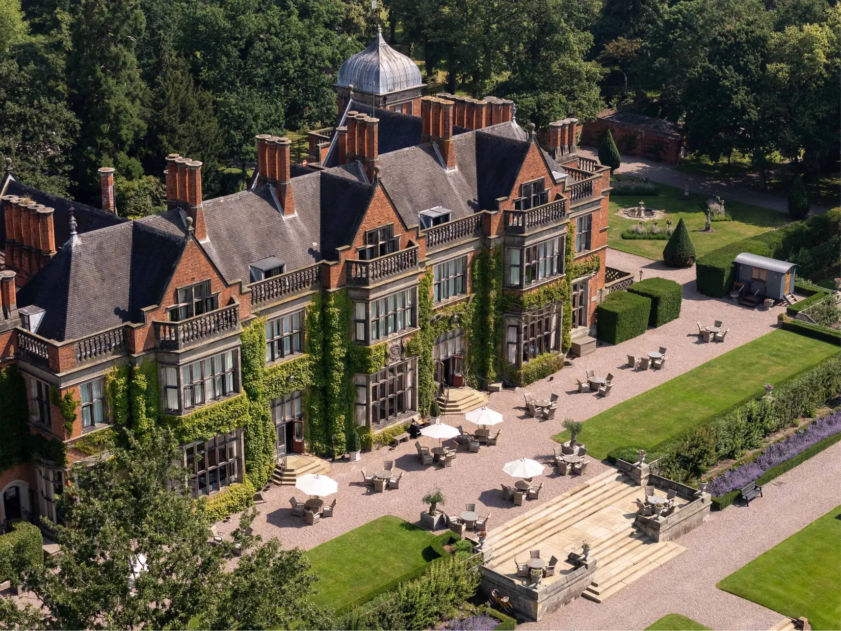 The house and gardens at Hoar Cross Hall from the air