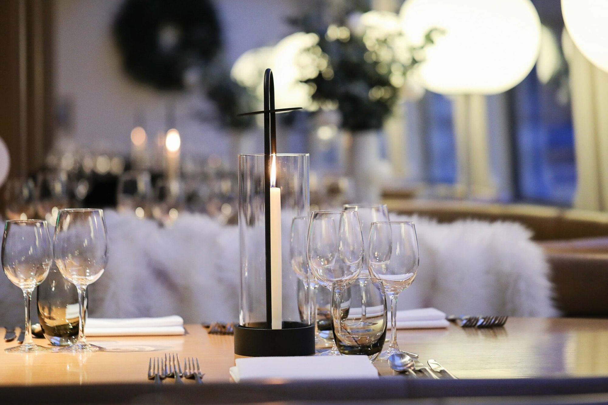 A candlelit Christmas table dressed for a party