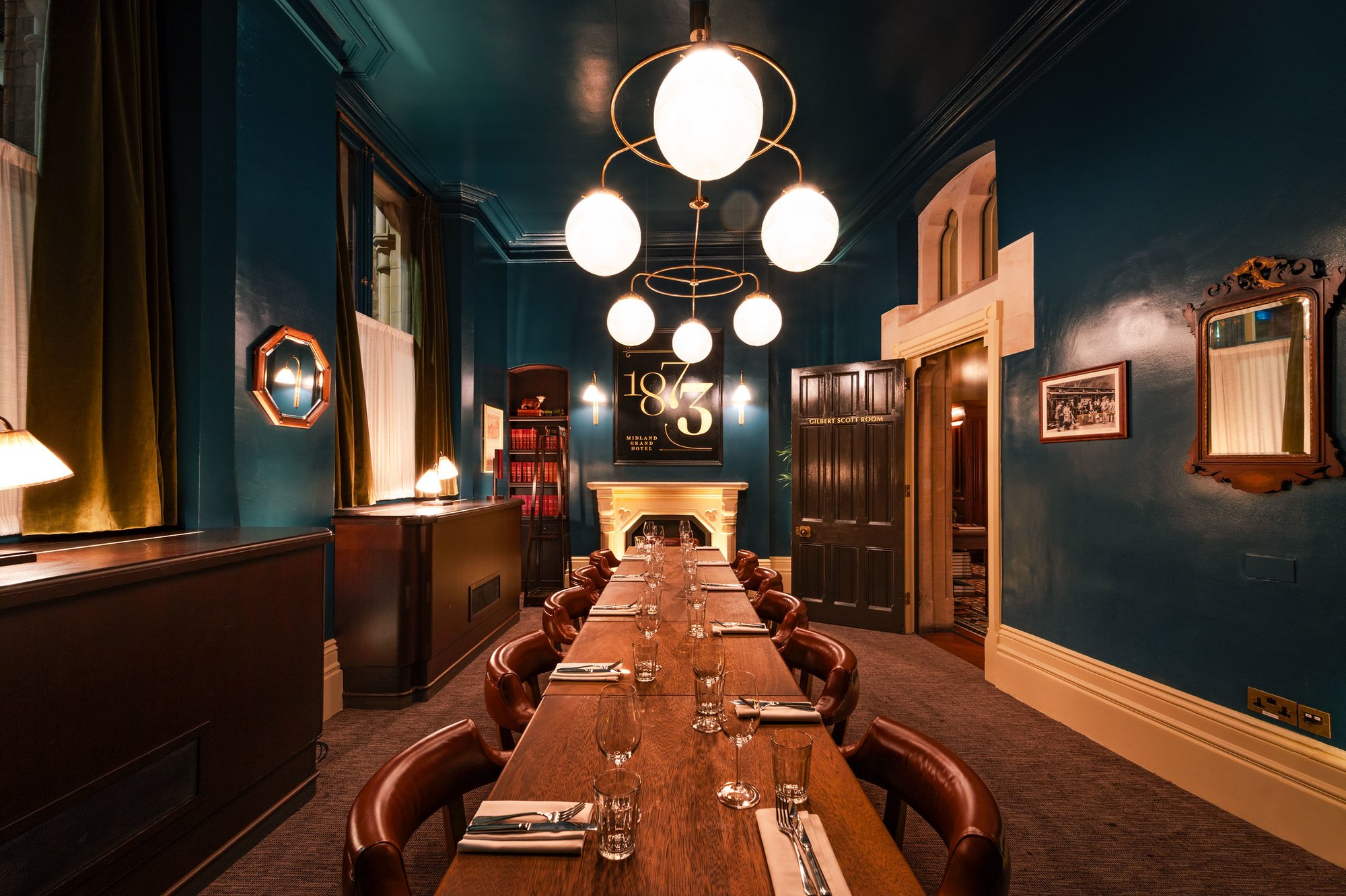 A panelled private dining room set for a long table at Hawksmoor